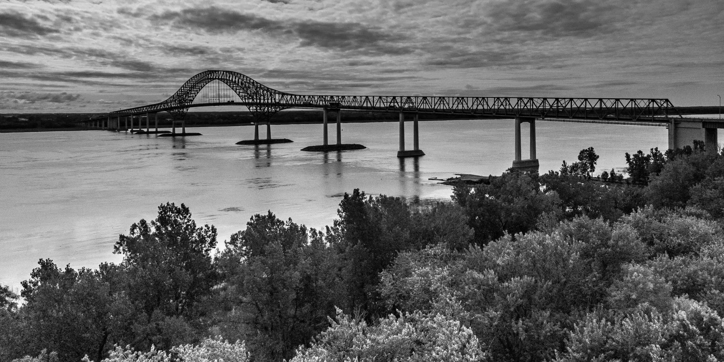 Quebec bridge spanning the river at dusk